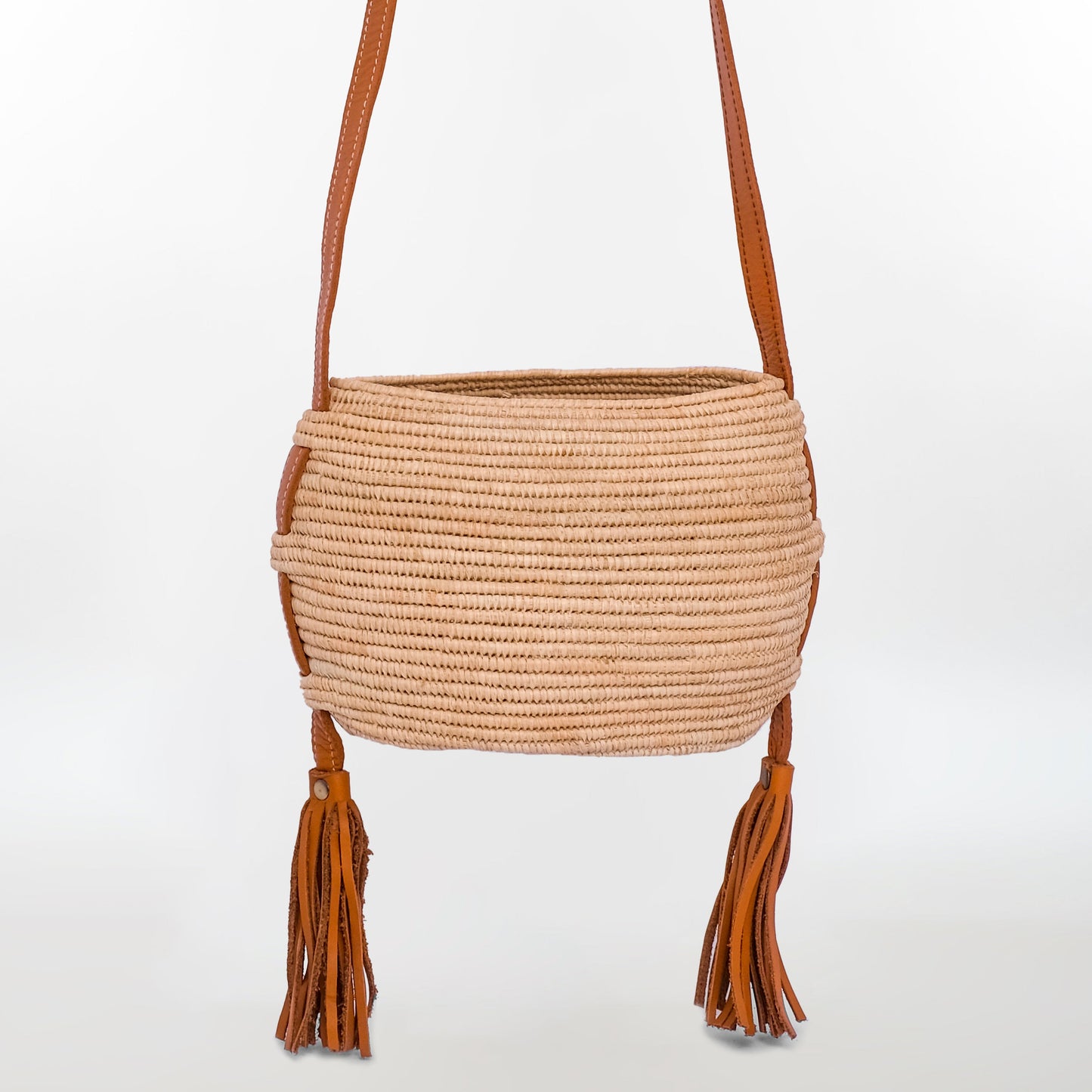 Handwoven raffia crossbody bag with leather tassels and tan leather strap – Moroccan artisan design