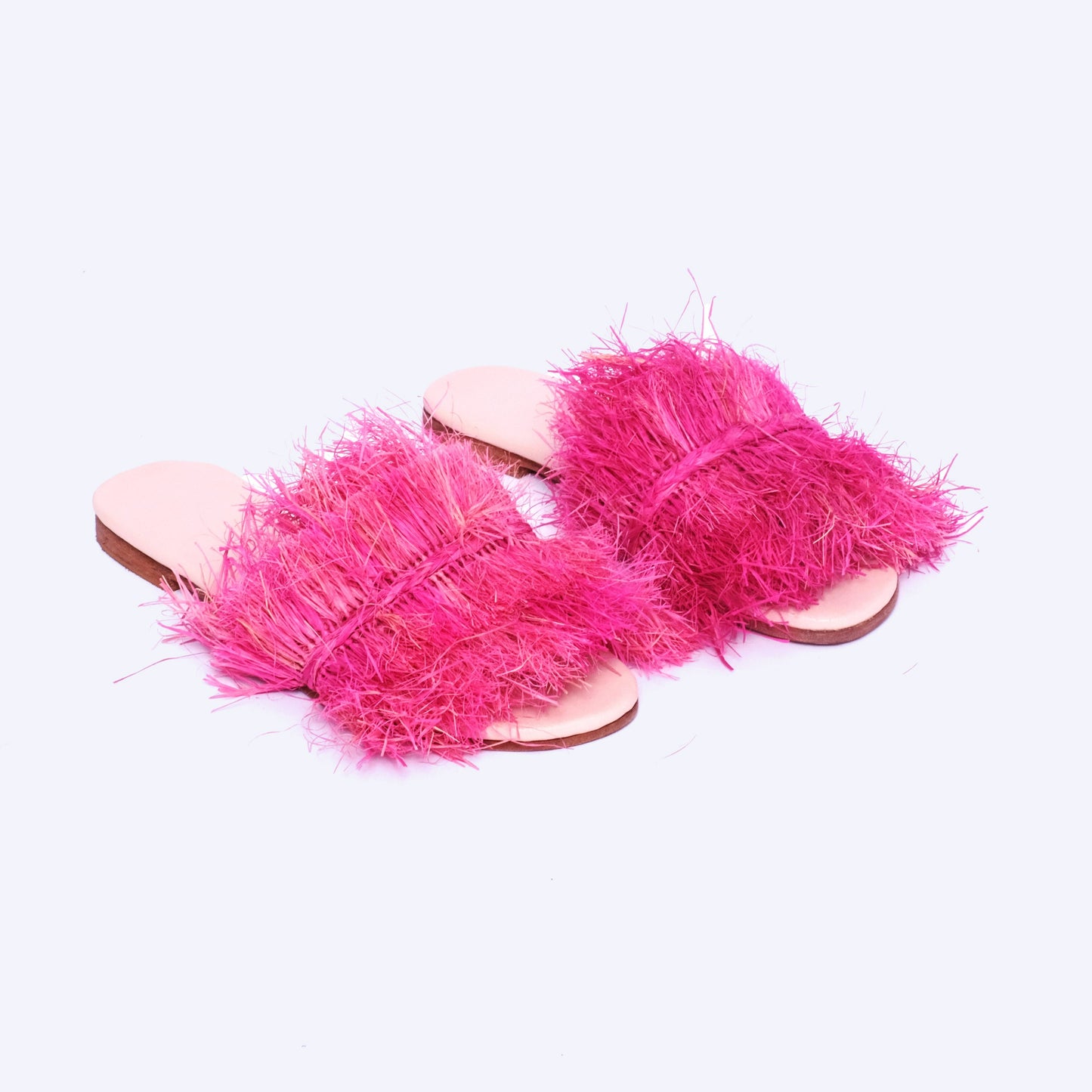 Handmade pink raffia fringe slides for women with leather insole, artisan-crafted in Morocco