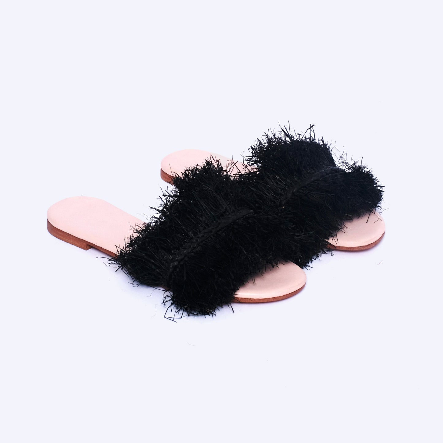 Black handmade raffia fringe flat sandals with open toe and natural sole