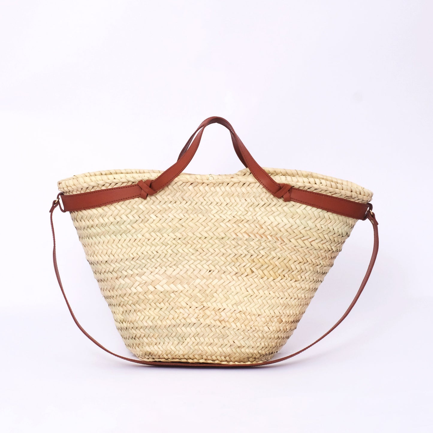 Minimal Moroccan straw tote with slim leather handles and detachable strap