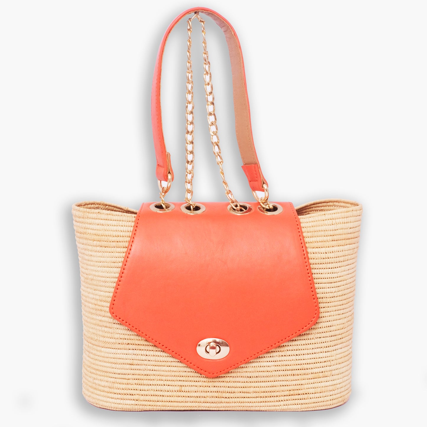 Raffia tote bag with coral leather flap, gold chain straps, and turn-lock closure