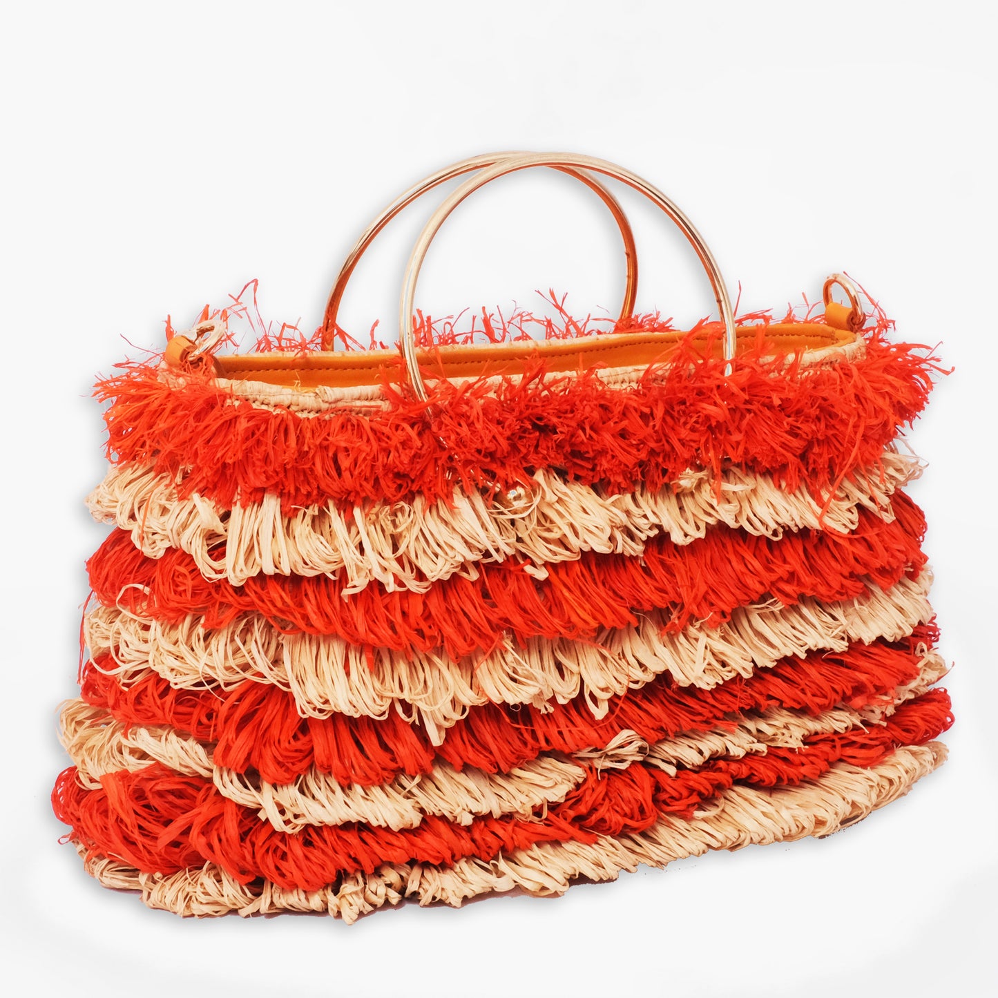 Striped raffia tote bag with layered orange and natural fringe and round gold metal handles