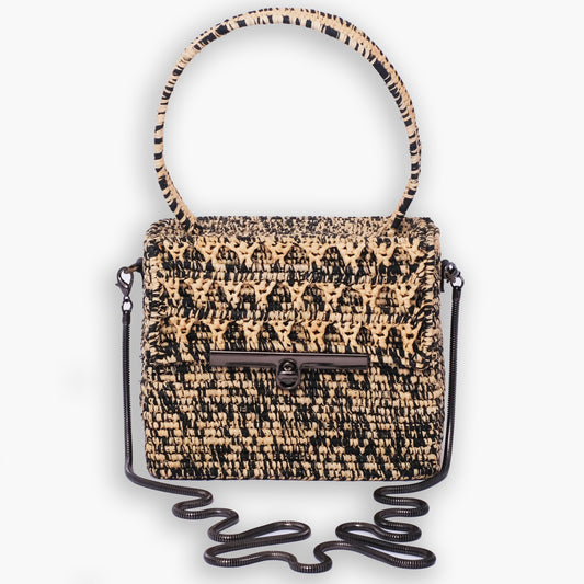 Structured black and natural raffia box bag with top handle and black metal chain strap