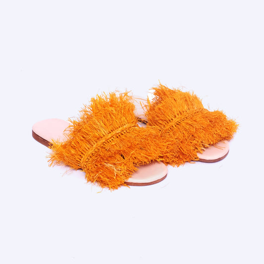 Bright orange raffia fringe slides with leather insole, handcrafted by Moroccan women artisans
