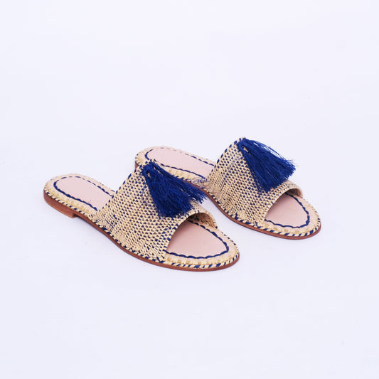 Natural raffia slides with navy tassels and leather insole, handmade by Moroccan artisans