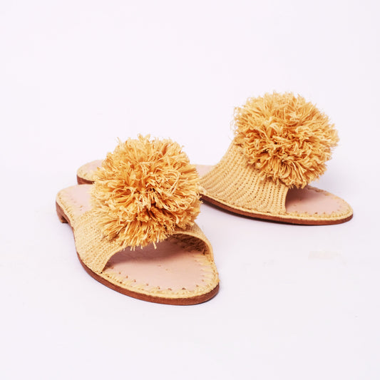 Natural raffia slides with large pom-poms and leather insole, handmade in Morocco