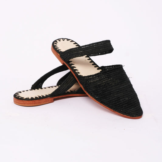 Handwoven black raffia flat sandals with pointed toe and ankle strap, leather sole, handmade in Morocco.