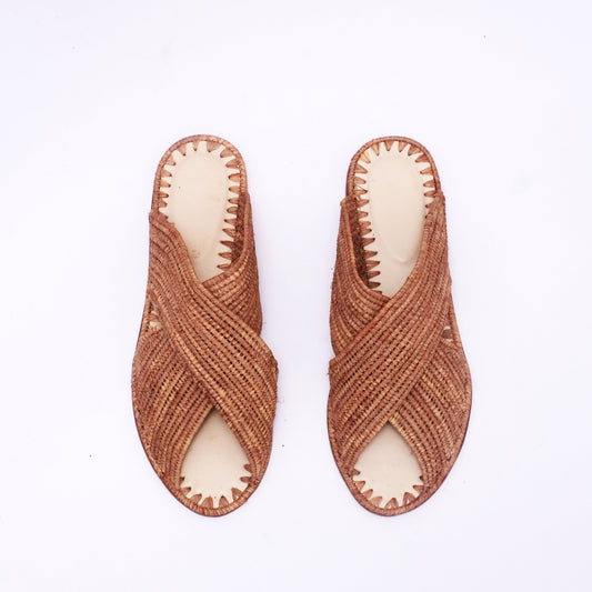 Handwoven brown raffia criss-cross sandals with open-toe and flat sole