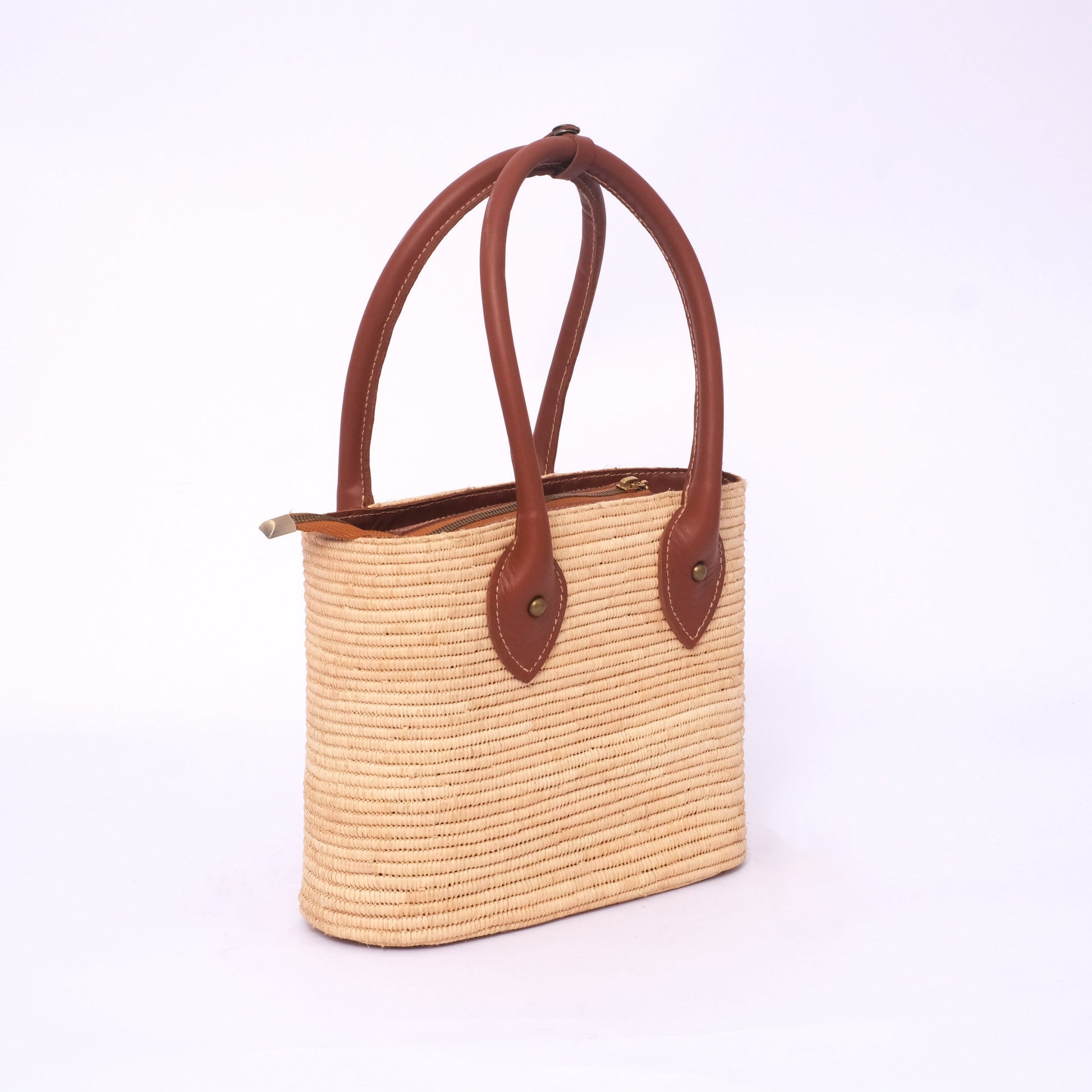 Embrace Sustainable Elegance with the Handwoven Raffia & Vegan Leather Bag