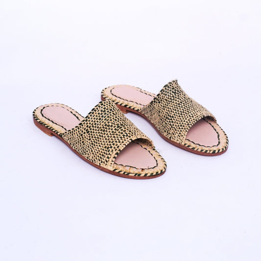 Flat black and natural raffia sandals handcrafted in Morocco with woven upper