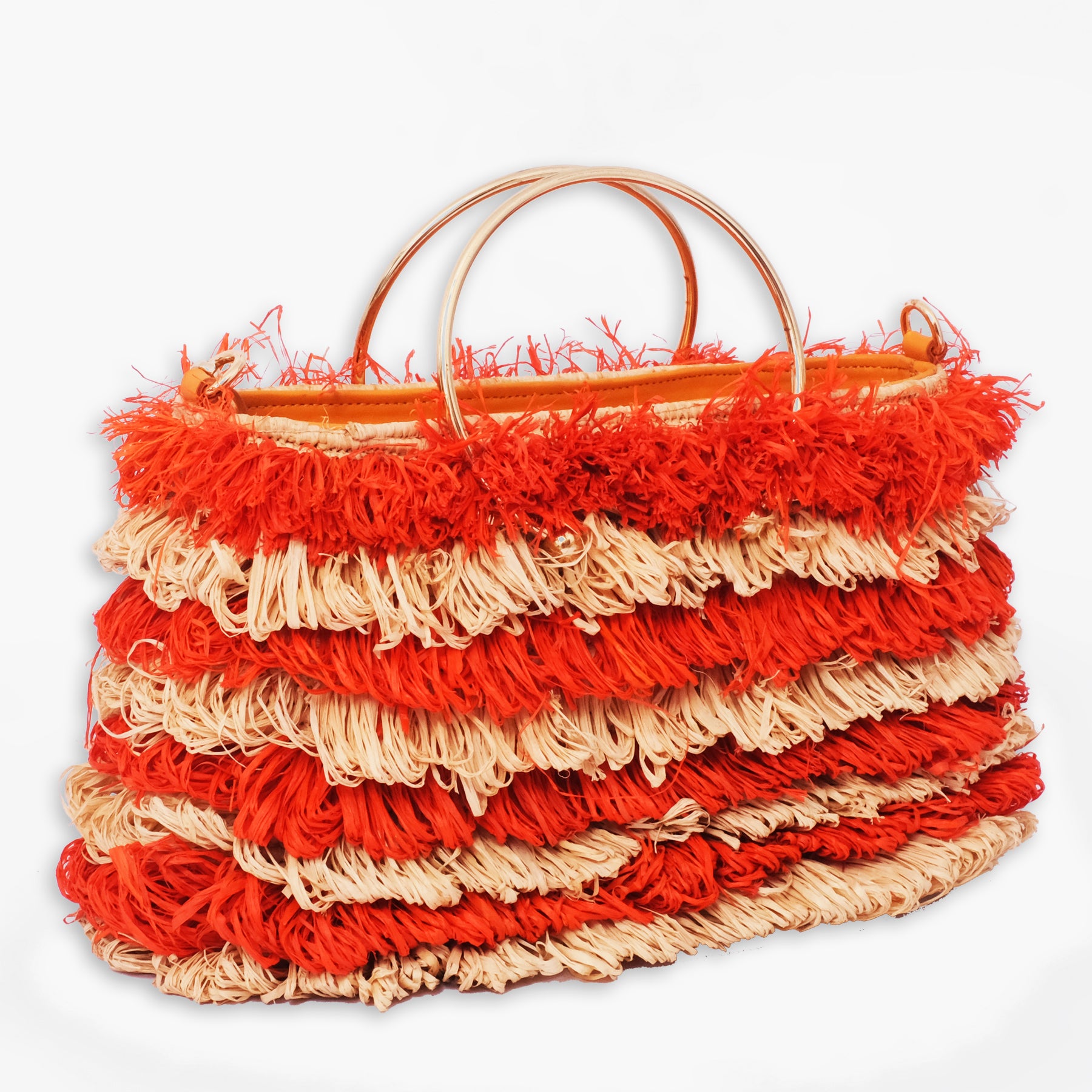 Striped raffia tote bag with layered orange and natural fringe and round gold metal handles